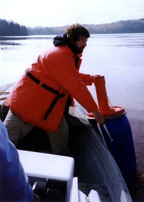 Dr. Page deploying a surface drifter, used to track the movement of surface water.